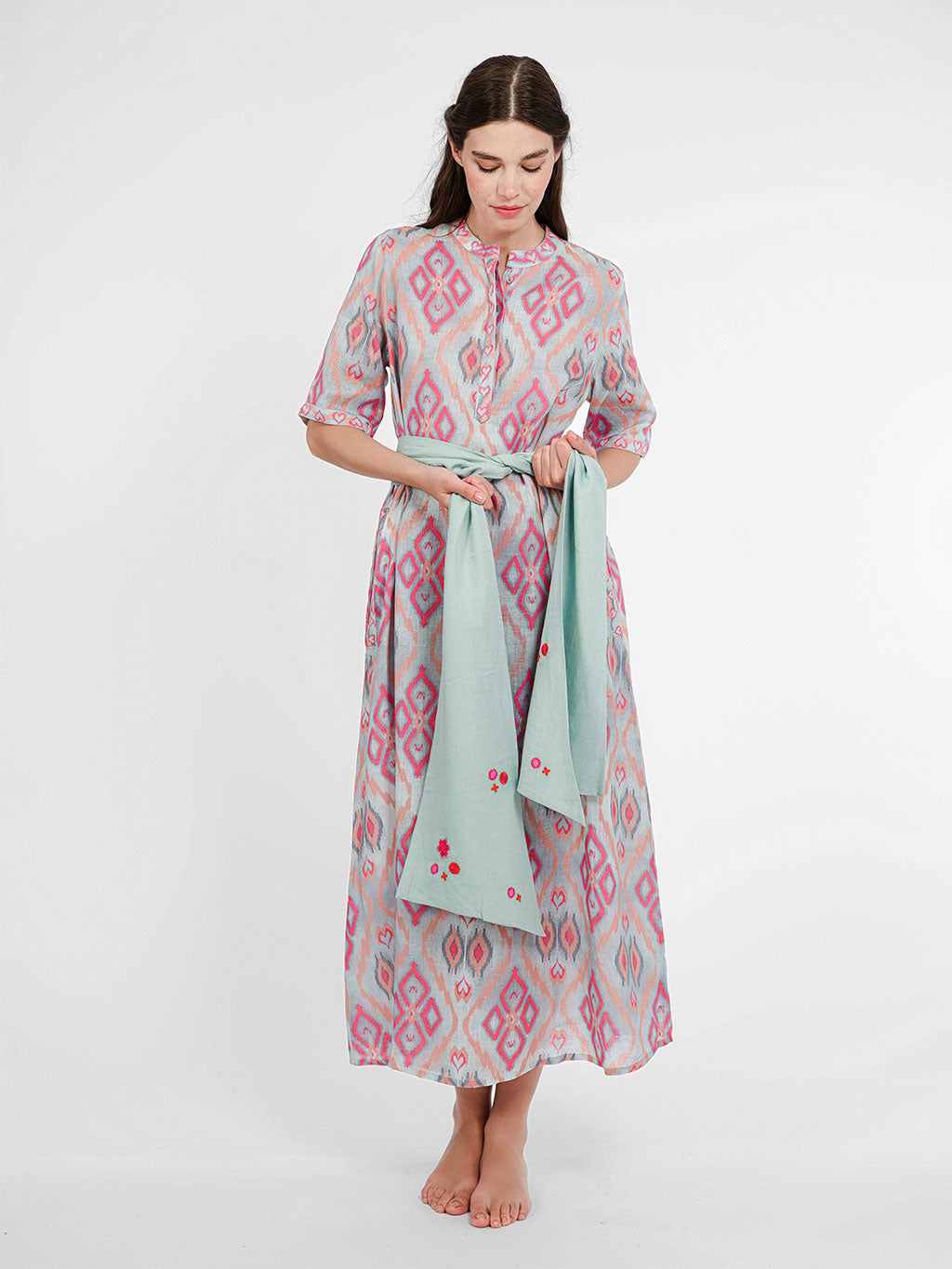 Model wearing the Cassia dress cinched with the contrasting Scarf Belt Mint for a high-impact, defined waist.