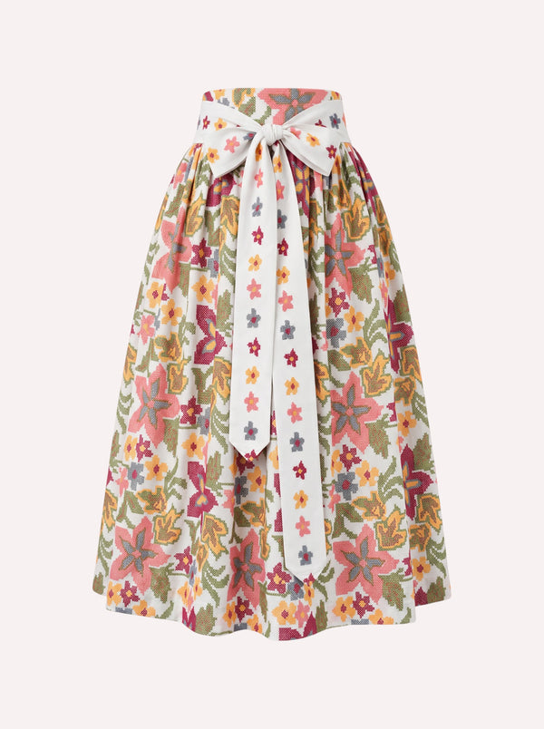 Nimo x Münchner Manufaktur cotton dirndl apron featuring an all-over vibrant green and red floral cross-stitch pattern.