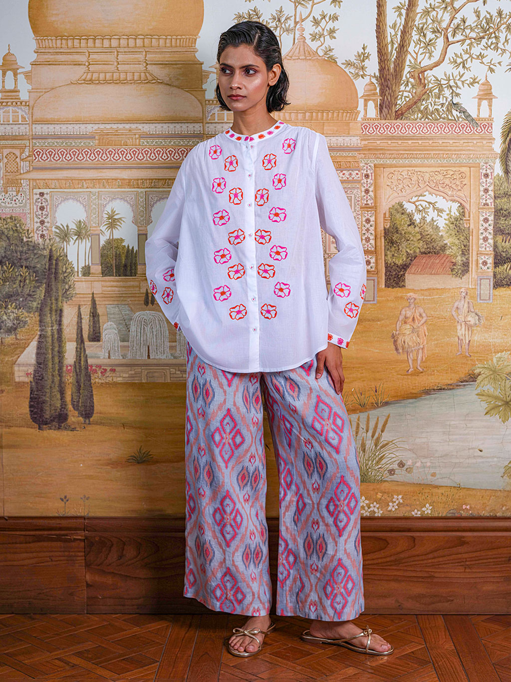 Model showcasing the fluid movement and sophisticated, easy fit of the Fennel linen pants in a resort setting