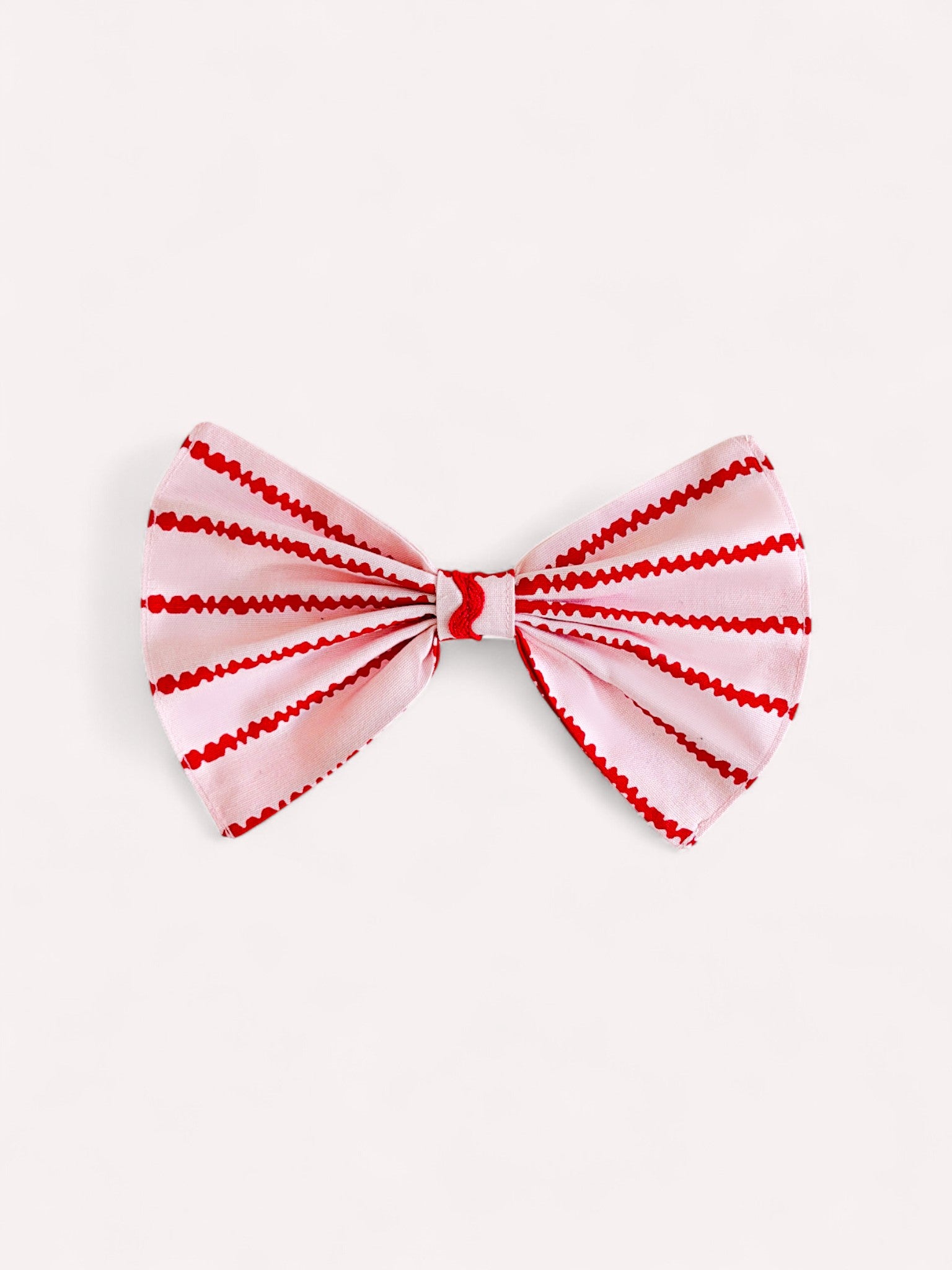 Red and white striped bow tie napkin ring