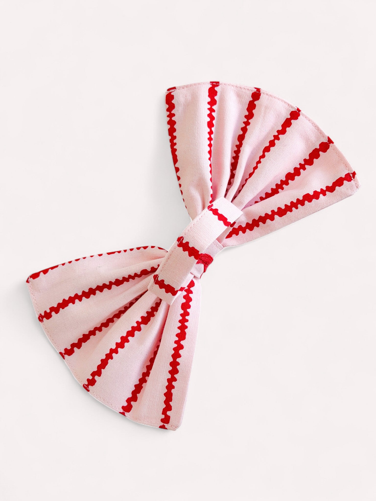 Bow napkin ring made from striped organic cotton