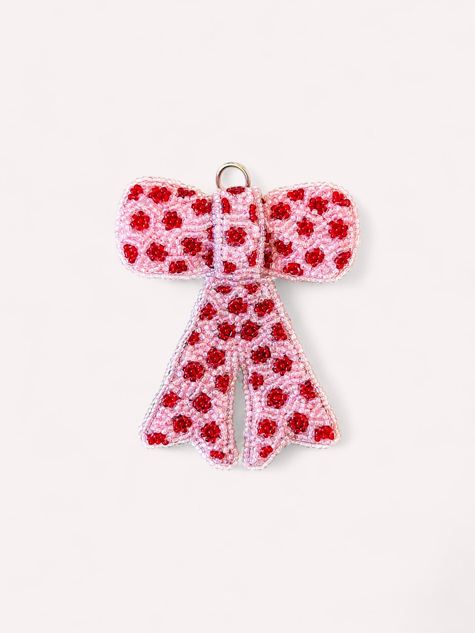 Decorative Christmas bow ornament with red and white beads