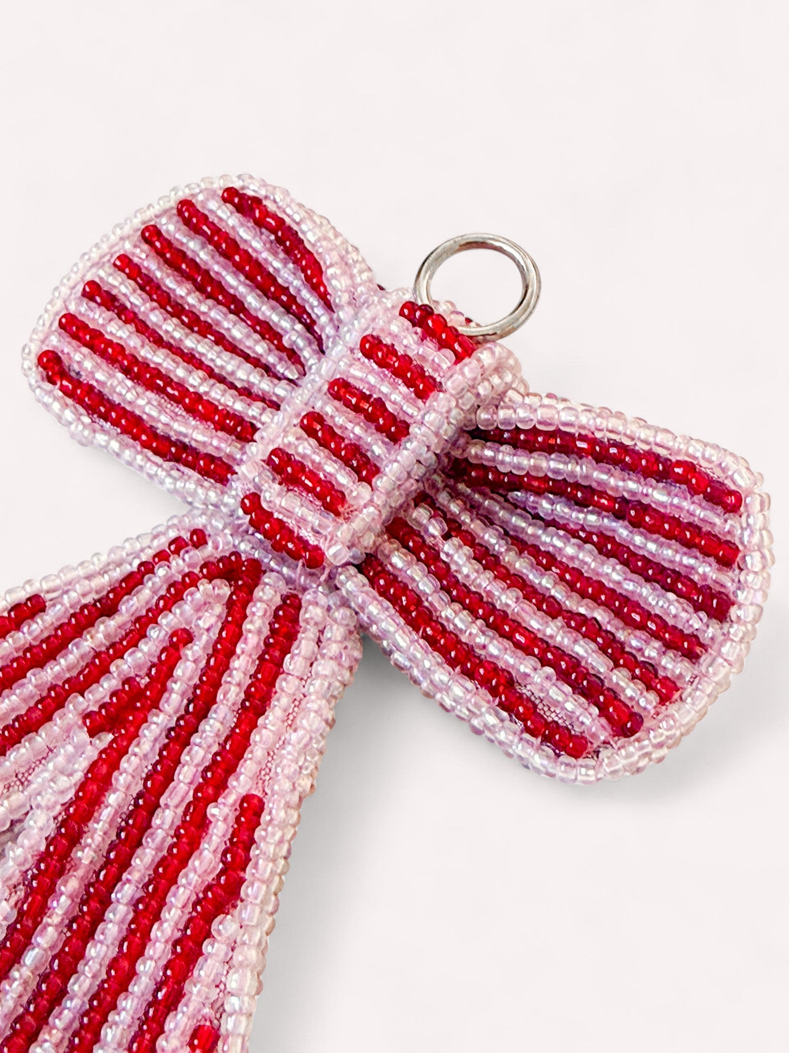 Beaded bow Christmas ornament with red and pink beads