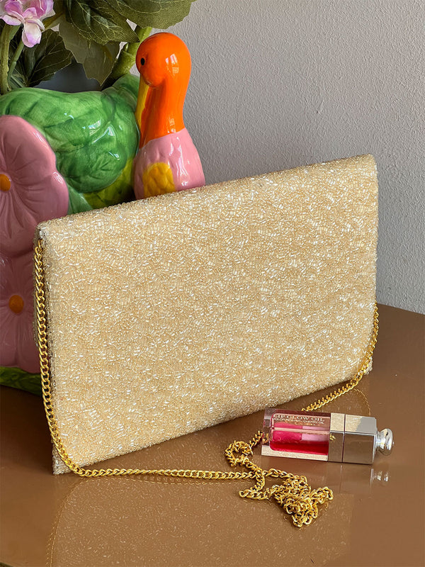 Reverse side of Nimo With Love Monkey Clutch — plain champagne glass bead finish with gold chain strap