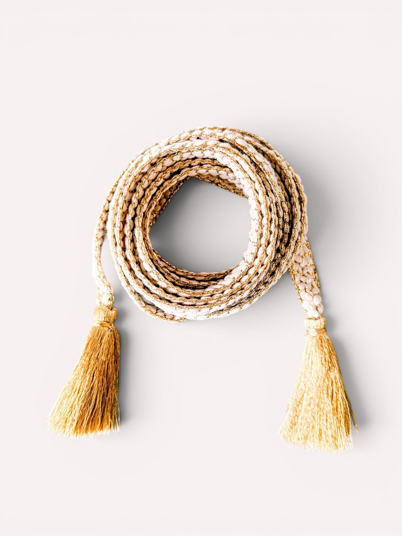 White and gold hand-braided cord belt with tassels by Nimo With Love