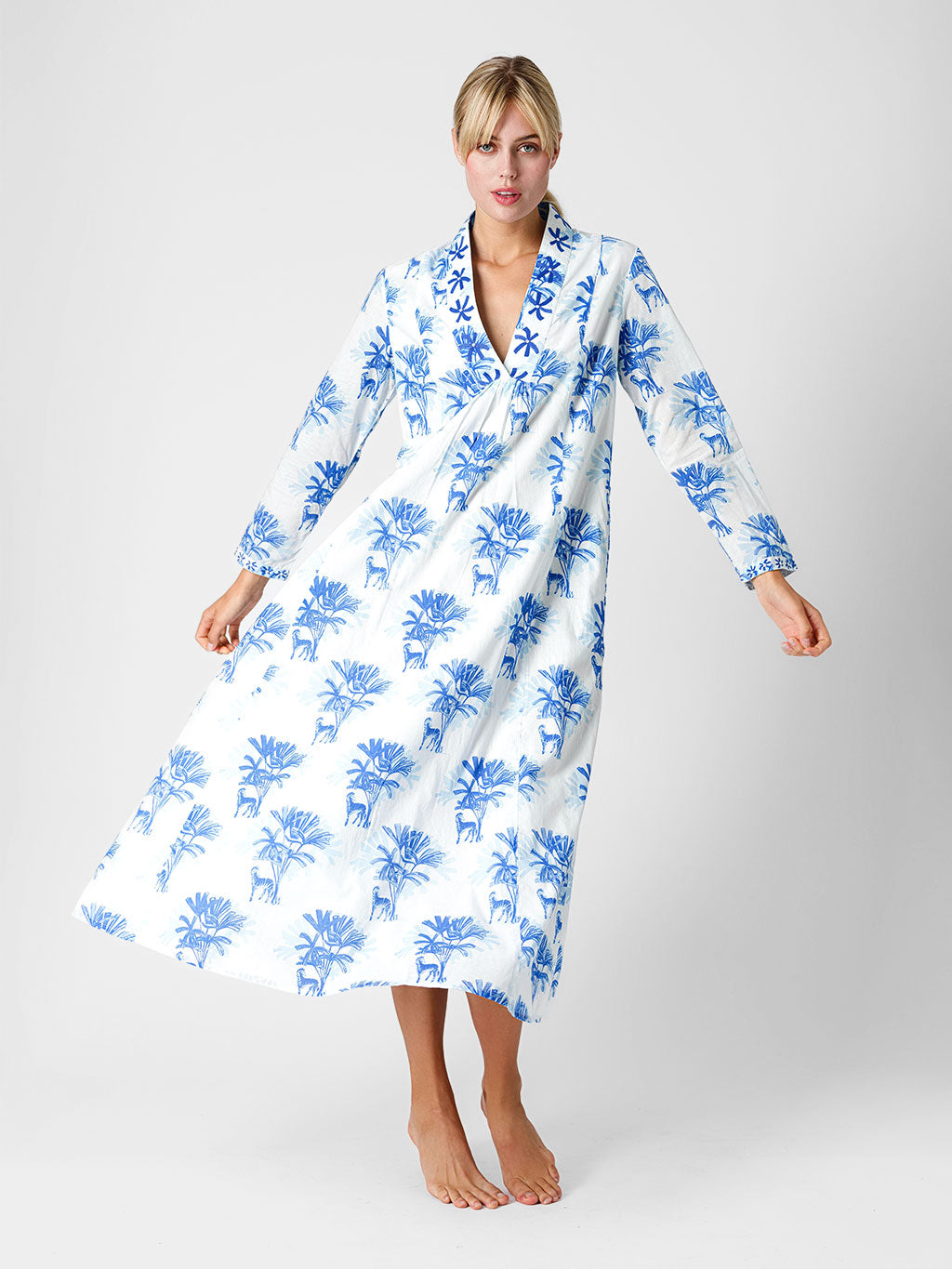 Model showcasing the effortless movement and breezy, sophisticated fit of the Sandalwood resort maxi dress.