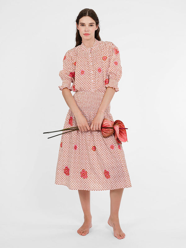 Model showcasing the refined, modest silhouette of the Bergamot blouse, perfectly tucked for a sleek resort look.