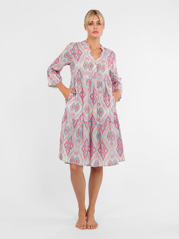 Knee-length oversized Borage tunic dress by Nimo With Love in ikat sorbet linen with an empire waist and tiered skirt.