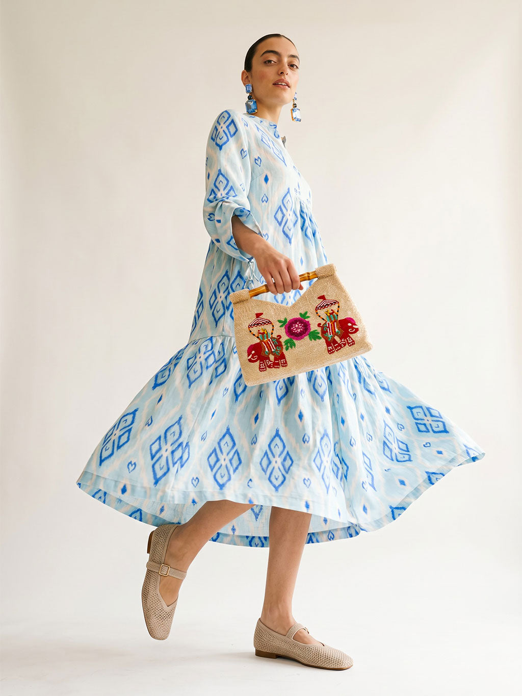 Front tiered gathered flounce hemline on the ankle-length light blue linen Catmint dress.