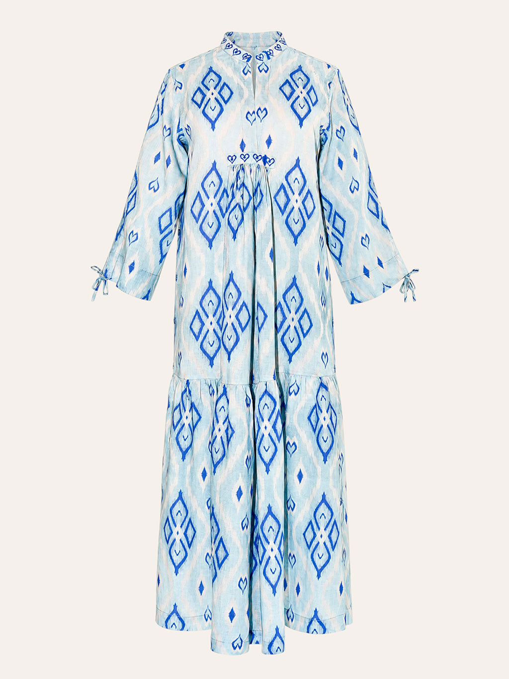 Front tiered gathered flounce hemline on the ankle-length light blue linen Catmint dress.