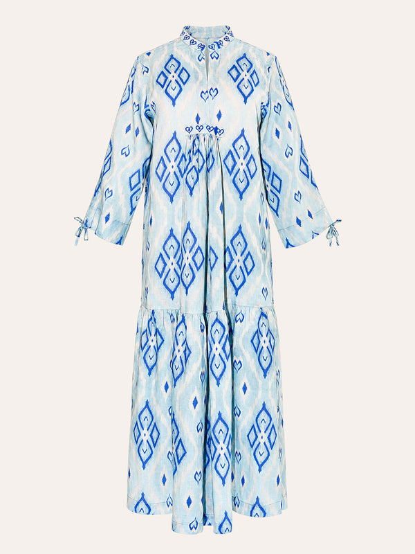 Front tiered gathered flounce hemline on the ankle-length light blue linen Catmint dress.