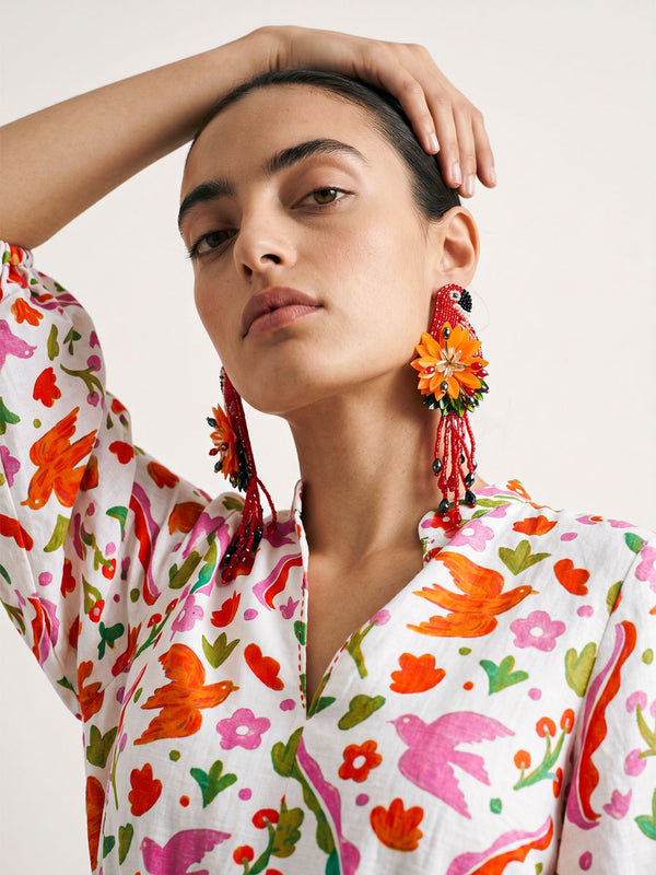 Close-up of the structured stand collar and deep V-neckline on the floral print Marigold linen dress.