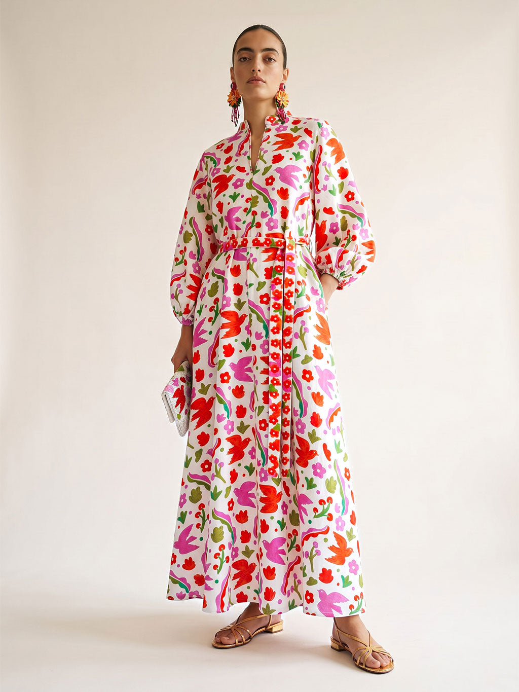 White Marigold linen maxi dress by Nimo With Love featuring a vibrant pink and orange botanical Mexico print.