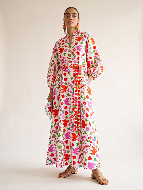 White Marigold linen maxi dress by Nimo With Love featuring a vibrant pink and orange botanical Mexico print.