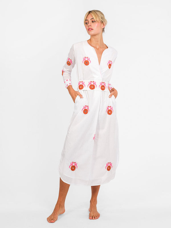 White organic cotton Amethyst Kaftan dress by Nimo With Love with pink and orange bird embroidery and a wrap-effect neckline. Belt sold separately.