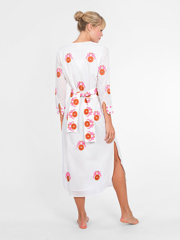 Rear view of the Amethyst Kaftan dress showing the placement of the bird motifs and the high side slits for easy movement.