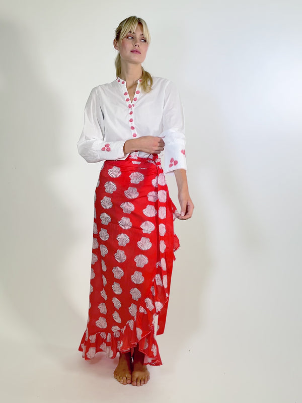 Video showing the red organic cotton wrap skirt with white shell print by Nimo With Love