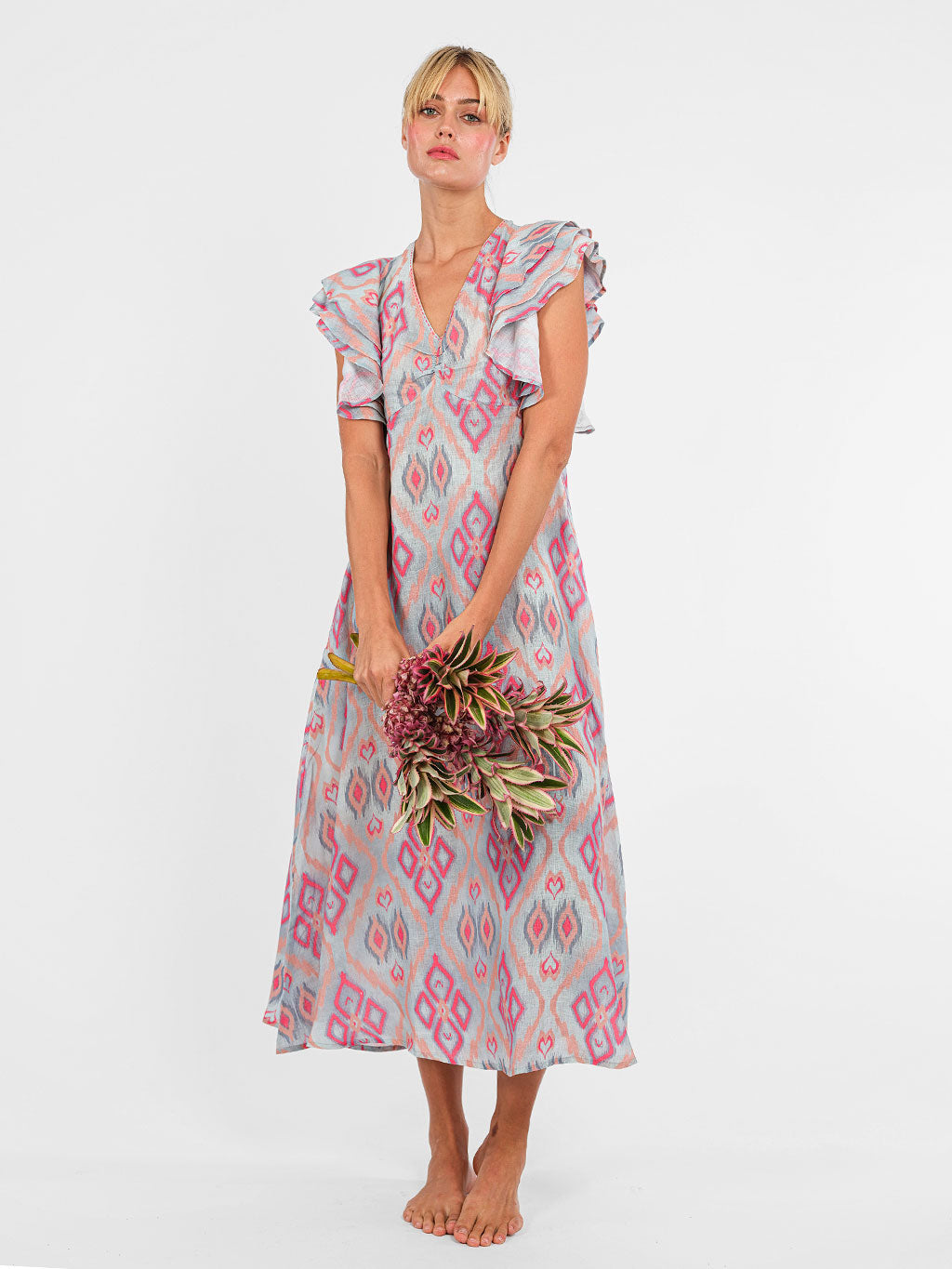 Midi-length Belladonna boho dress by Nimo With Love in ikat printed linen with statement ruffle sleeves